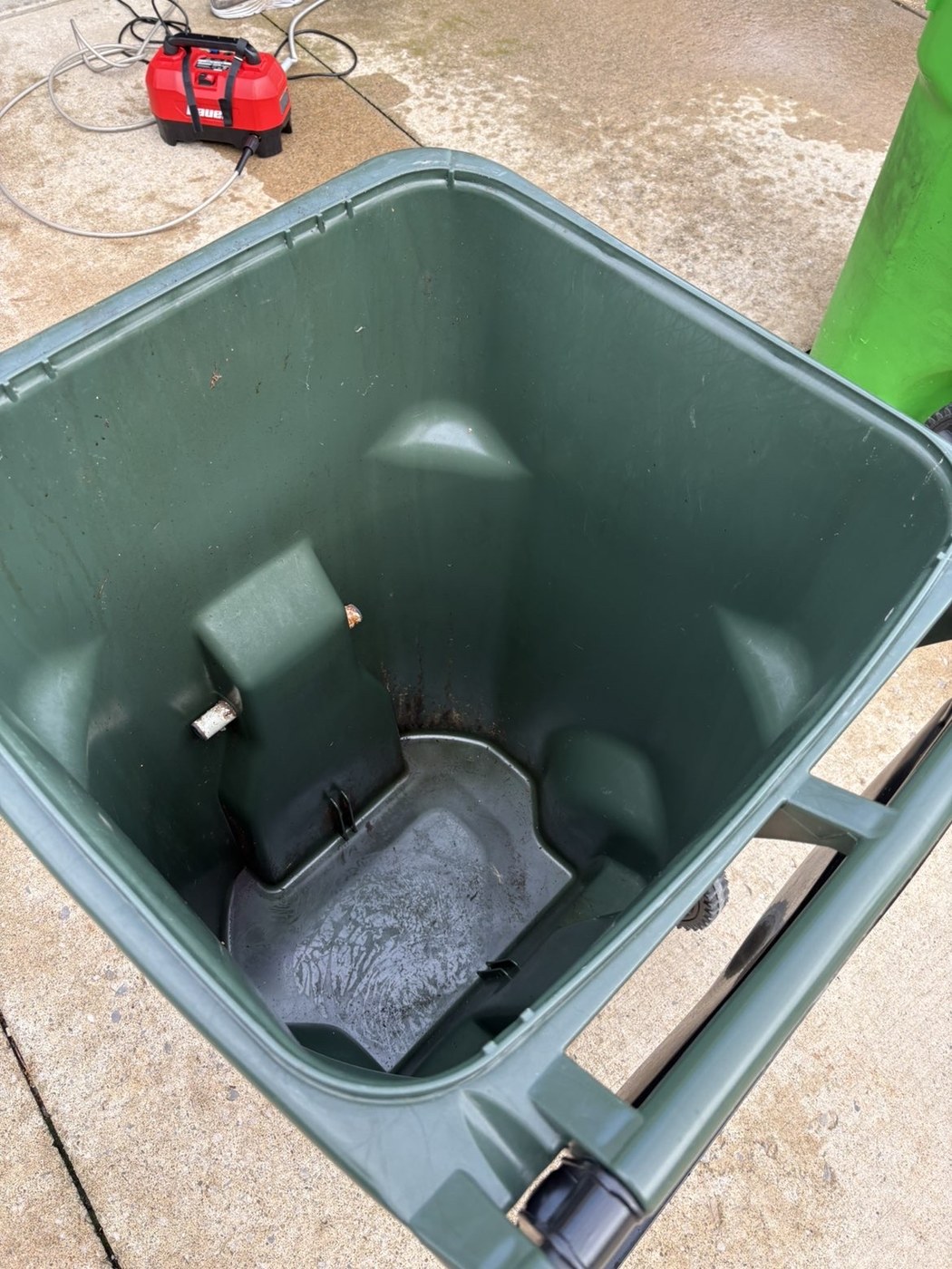 Dirty grey trash bin interior before cleaning