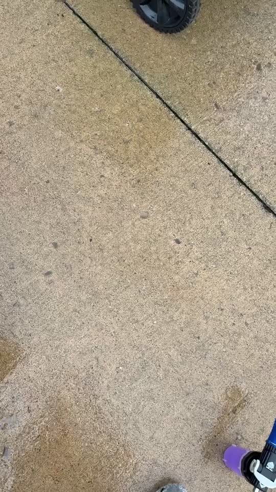 Surface cleaner lifting embedded dirt from a concrete driveway
